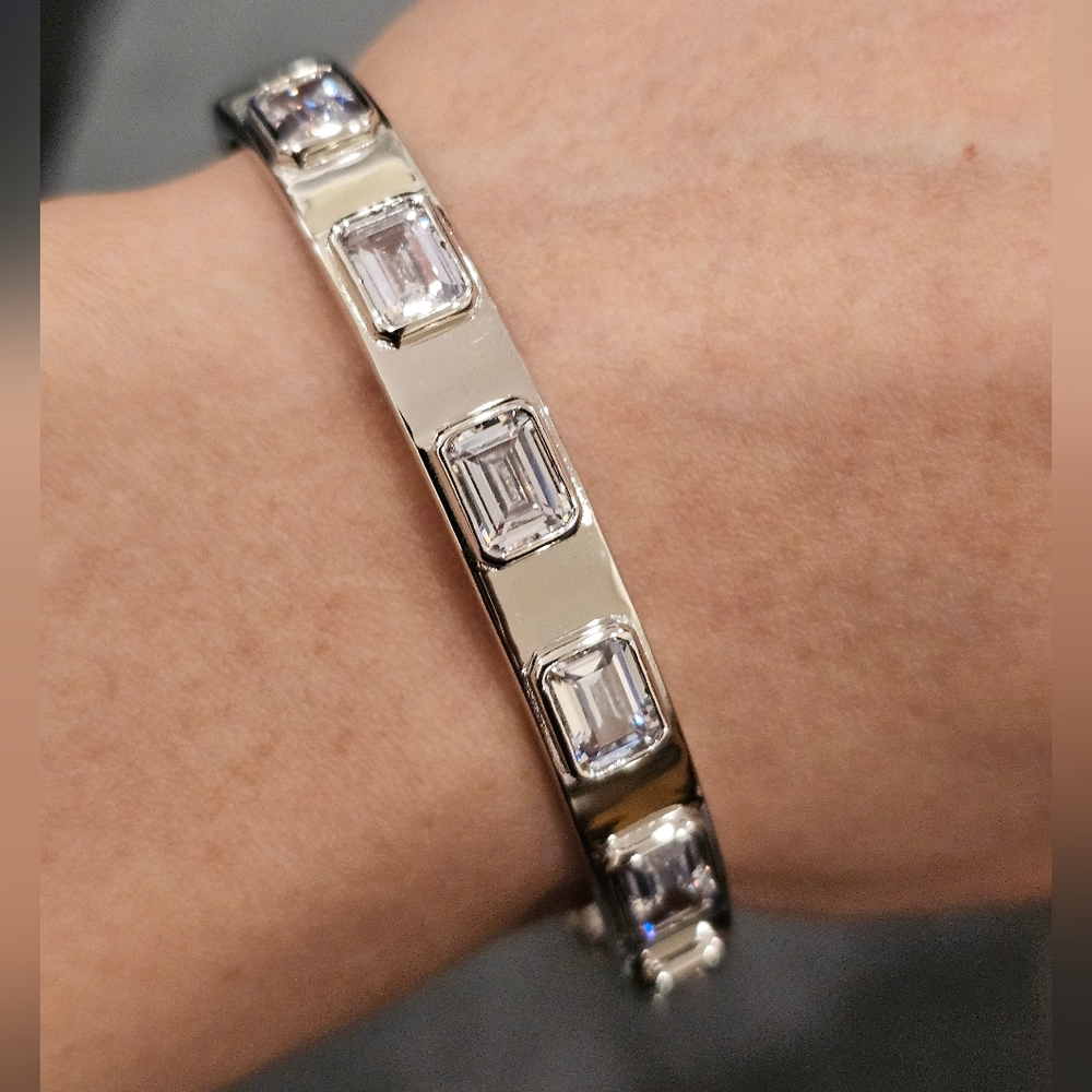 Emerald cut Cubic Zirconia set in sterling silver bangle. 7"circumference.